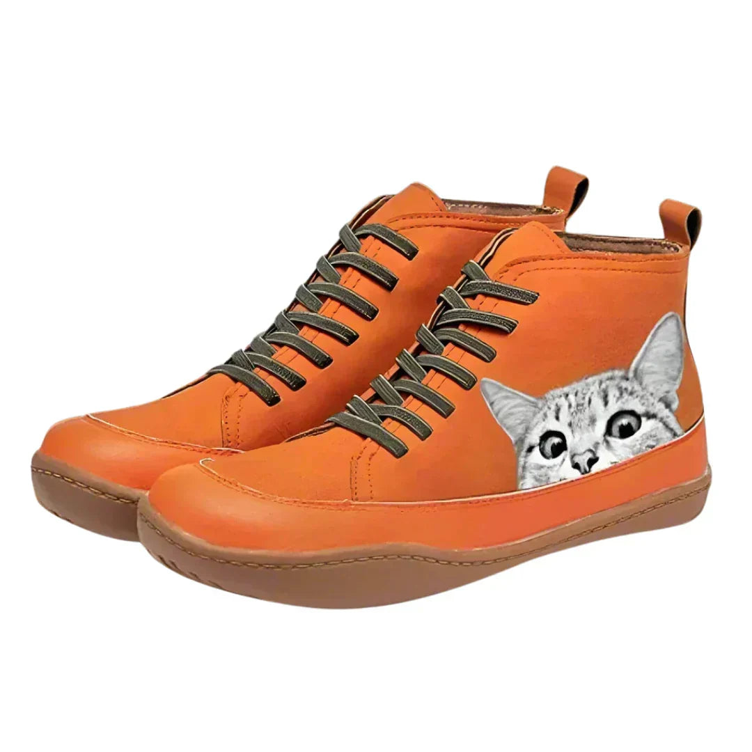Orange high top boots with cat print detail, side view