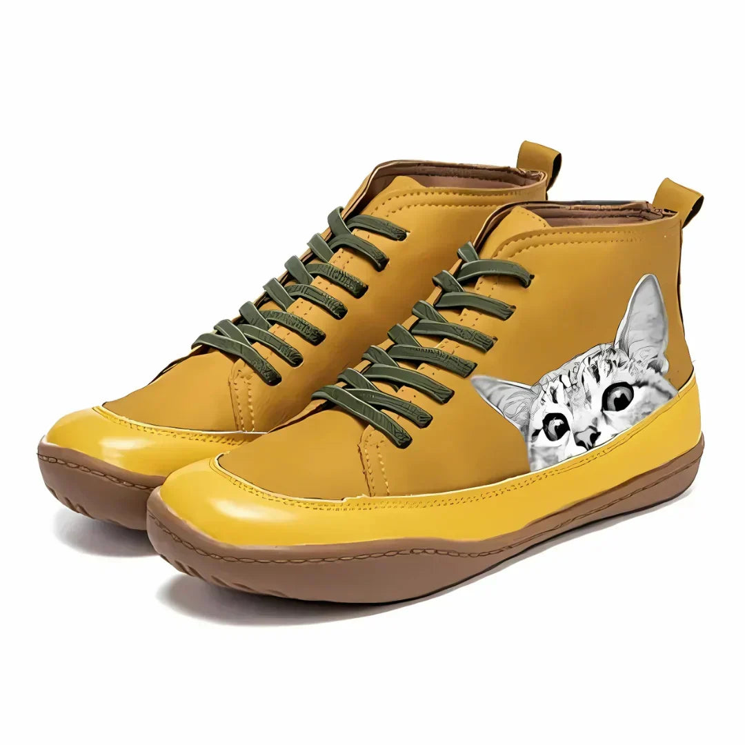 Yellow high top boots with cat print detail, side view