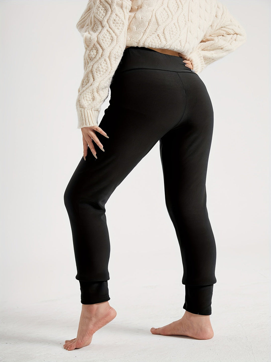 Black leggings back view with jogger style cuff