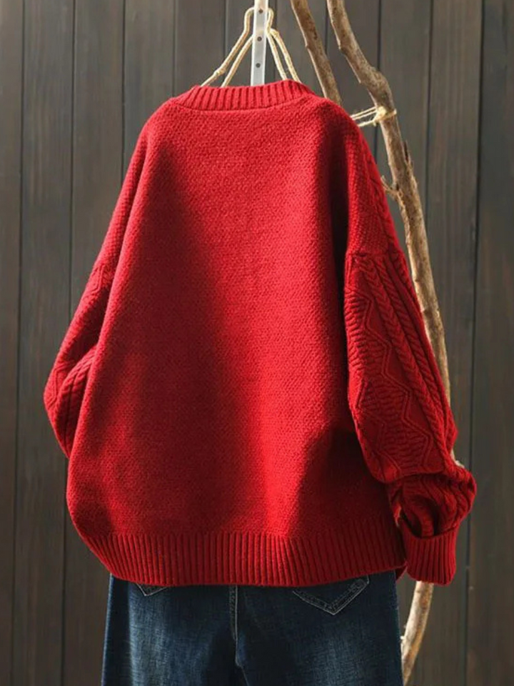 Back view of red cable knit cardigan