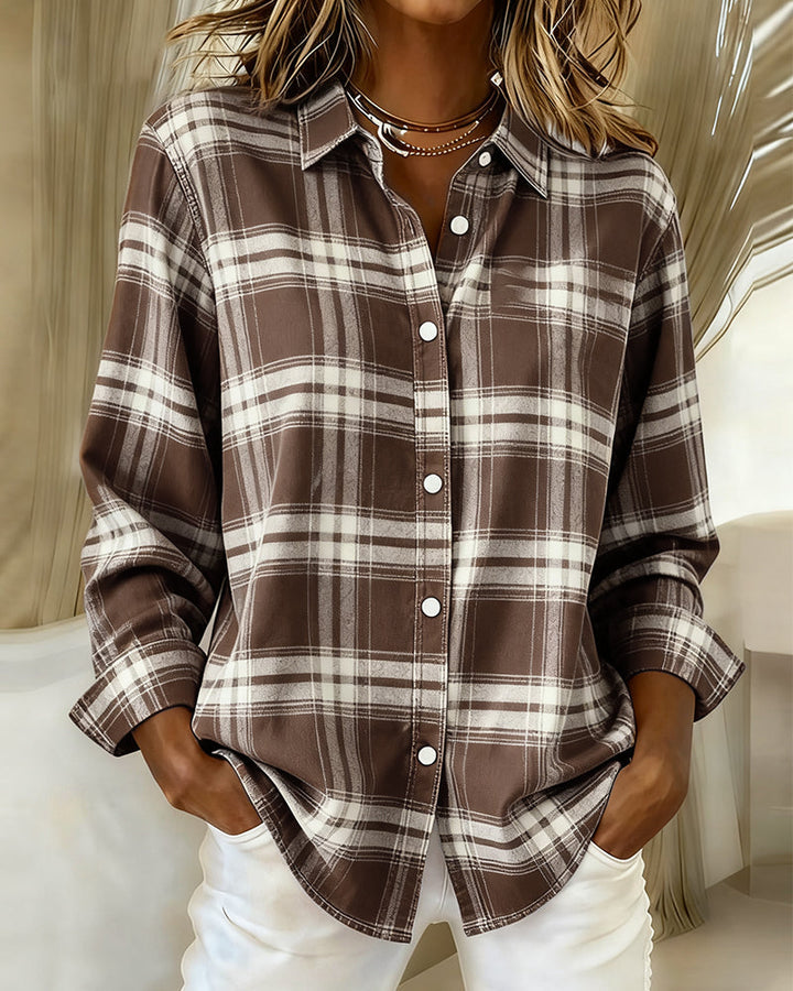 Woman wearing coffee brown and cream plaid overshirt