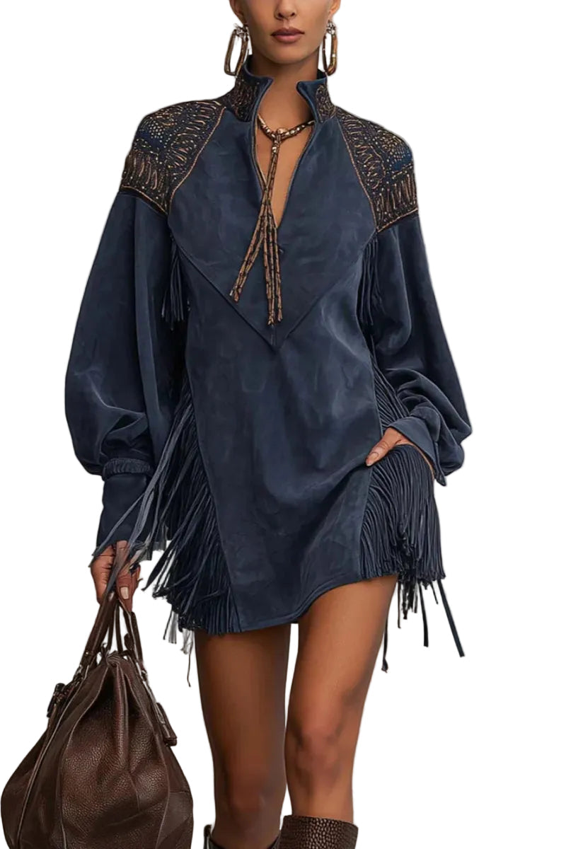 Woman wearing indigo faux suede mini dress with tassel fringe and zip collar, front view