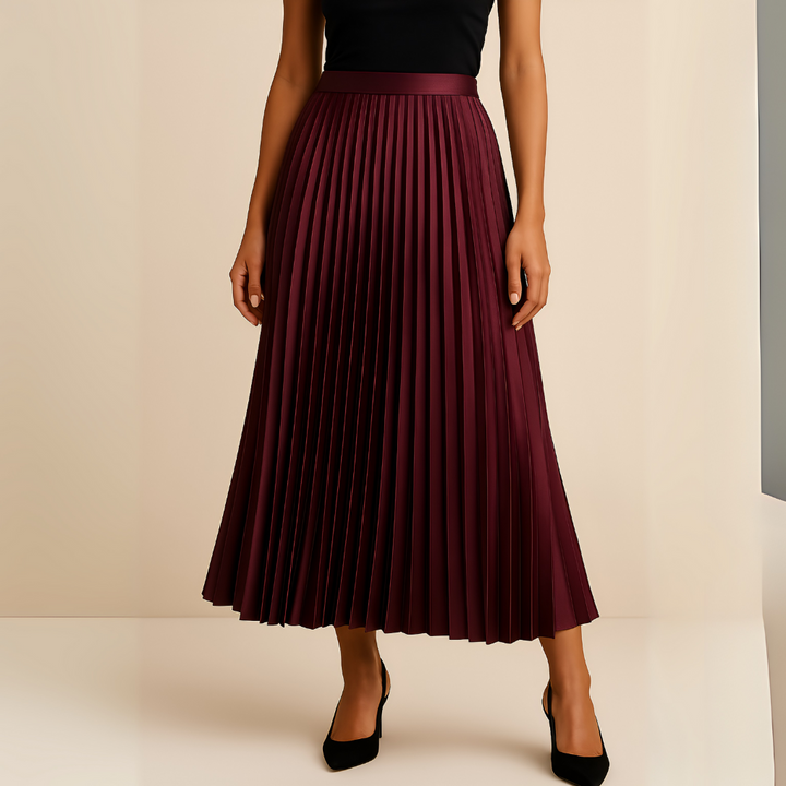 Woman wearing wine red pleated high-waist midi skirt with heels