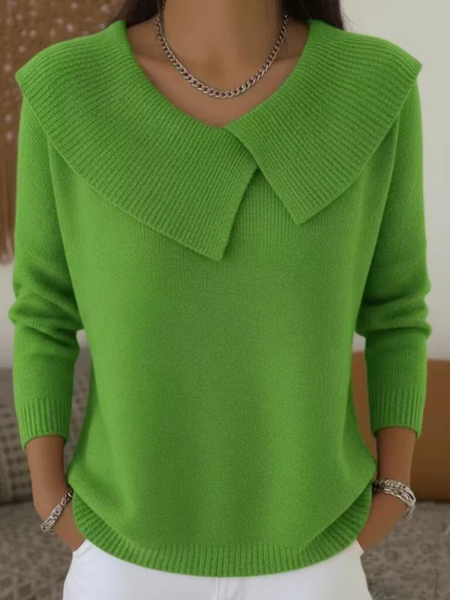 Woman wearing light green sweater with folded ribbed collar