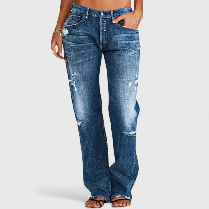 Dark blue distressed wide-leg jeans, front view with hand in pocket