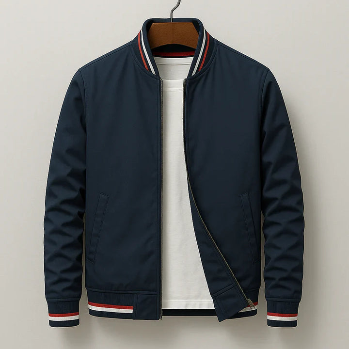 Navy bomber jacket with striped ribbed collar and cuffs on hanger