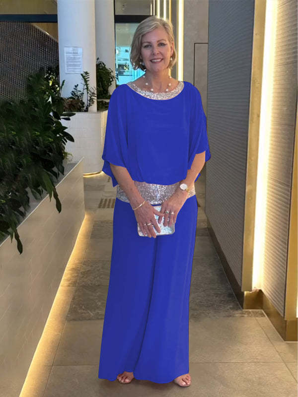 Woman wearing blue wide-sleeve top and wide-leg pants set with sequin trim