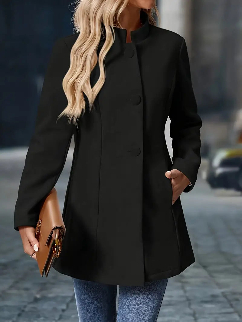 Black coat side view showing tailored waist shape