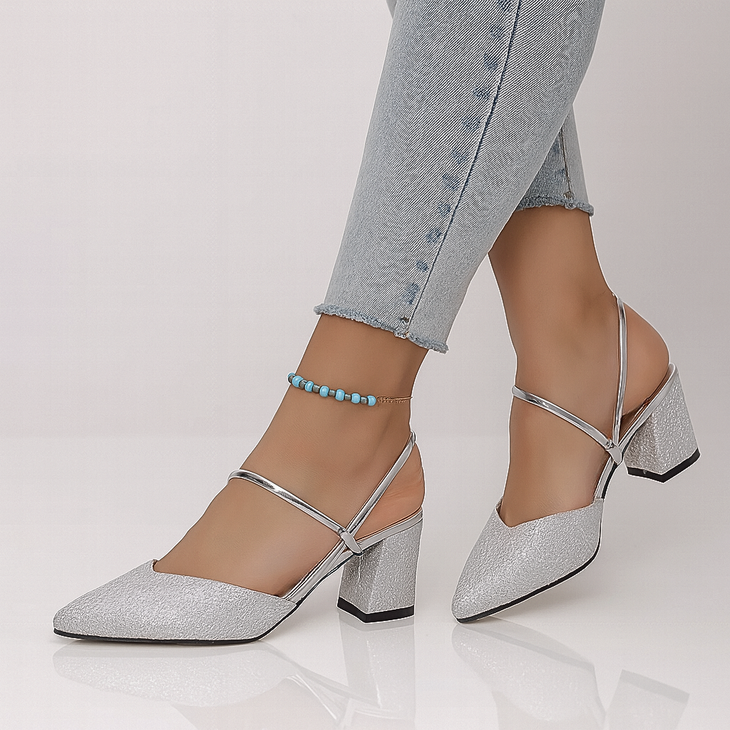 Silver shimmer slingback block heels with crisscross straps on model