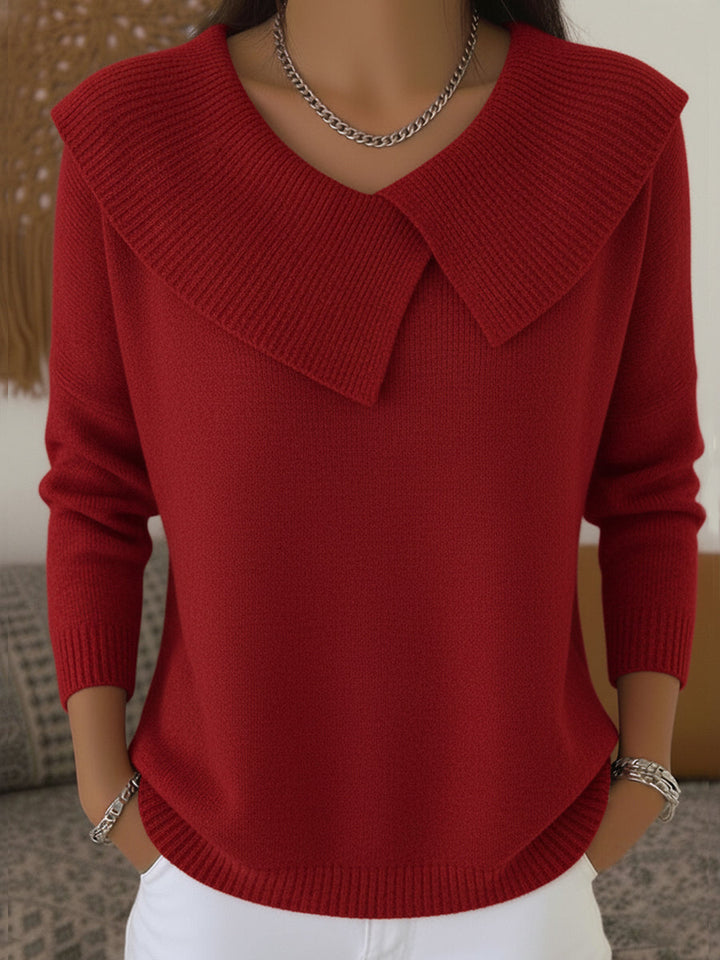 Woman wearing red sweater with folded ribbed collar