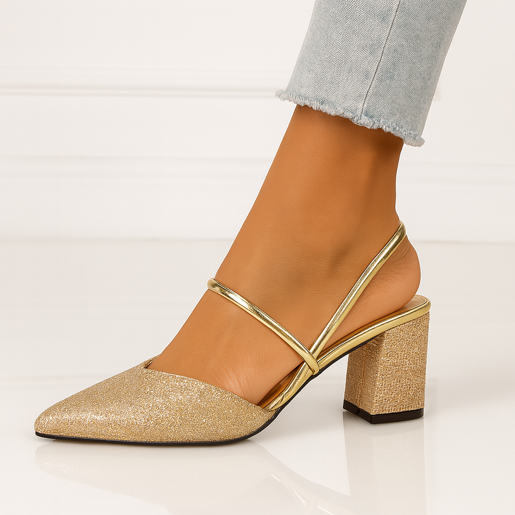 Gold shimmer block heel sandal close-up showing pointed toe and strap