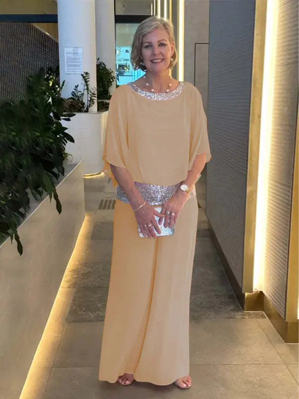 Woman wearing khaki wide-sleeve top and wide-leg pants set with sequin trim