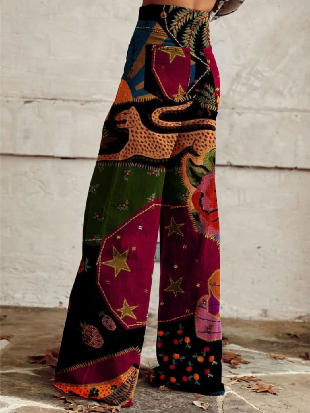 Wide leg patchwork print pants, side view showing back pocket