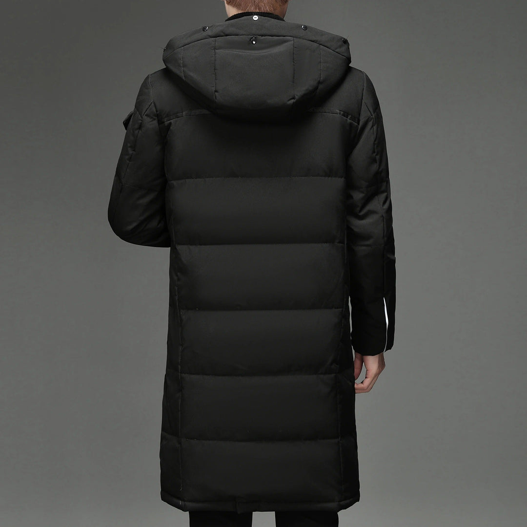 Back view of black hooded down coat showing quilted panels