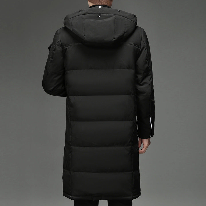 Back view of black hooded down coat showing quilted panels