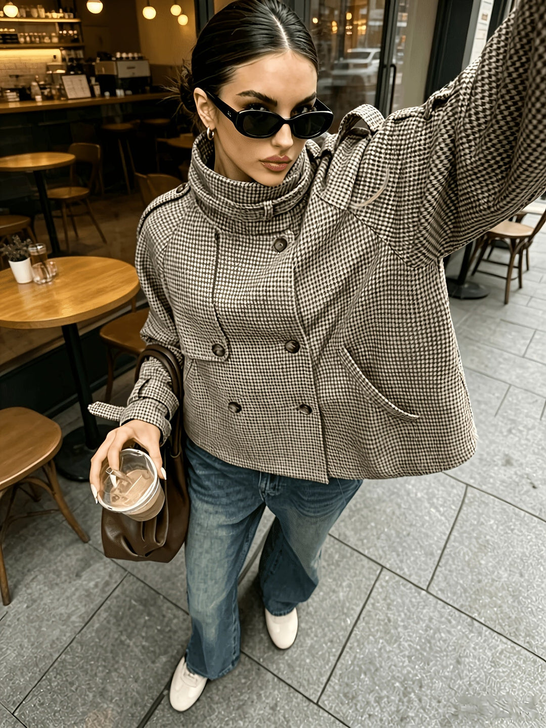 Close up of double breasted buttons and pockets on houndstooth jacket