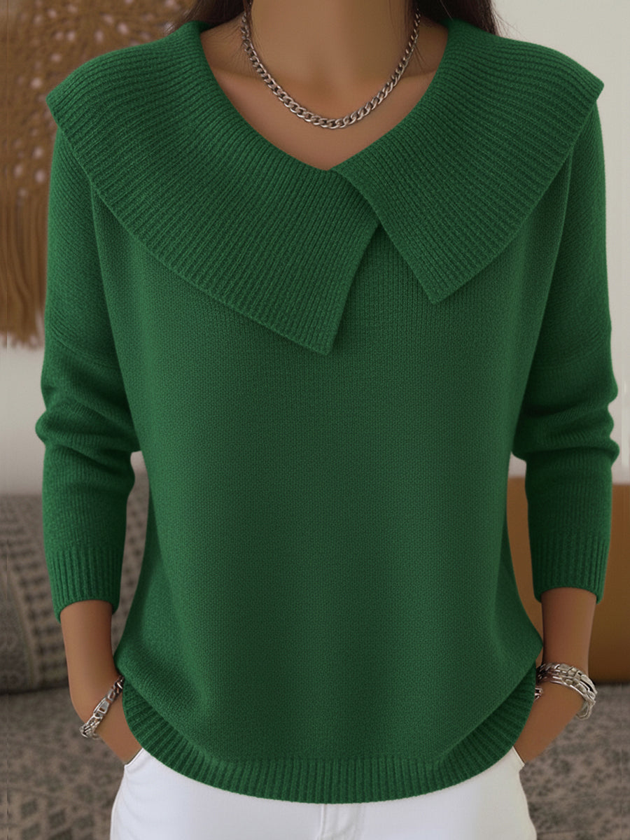 Woman wearing green sweater with folded ribbed collar