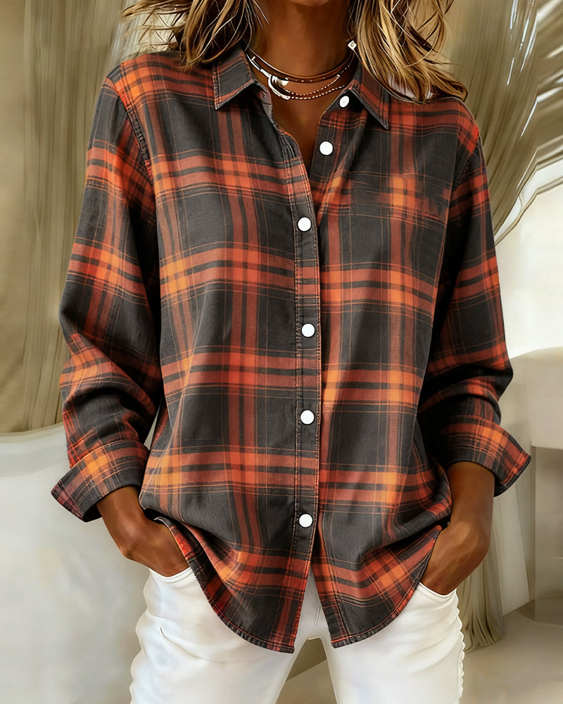Woman wearing orange and black plaid button front overshirt