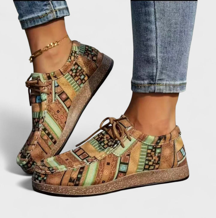 Khaki patchwork print lace-up sneakers on model, side angle