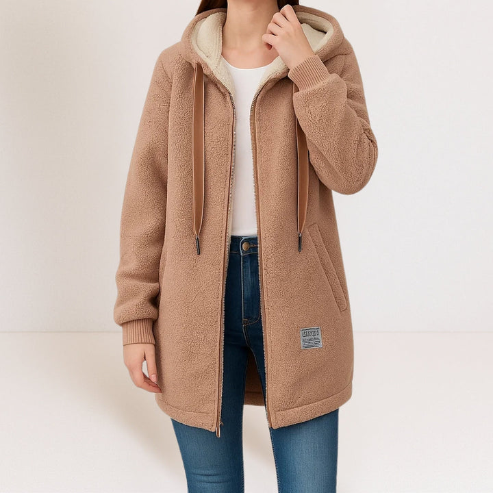 Woman wearing brown sherpa fleece longline hooded jacket with zip front