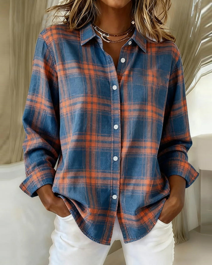 Woman wearing blue and orange plaid overshirt with notch lapel
