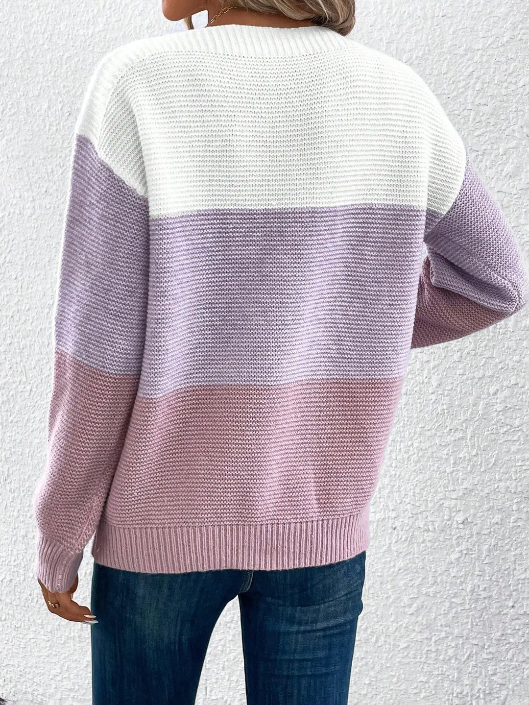 Back view of lavender and pink color block knit sweater