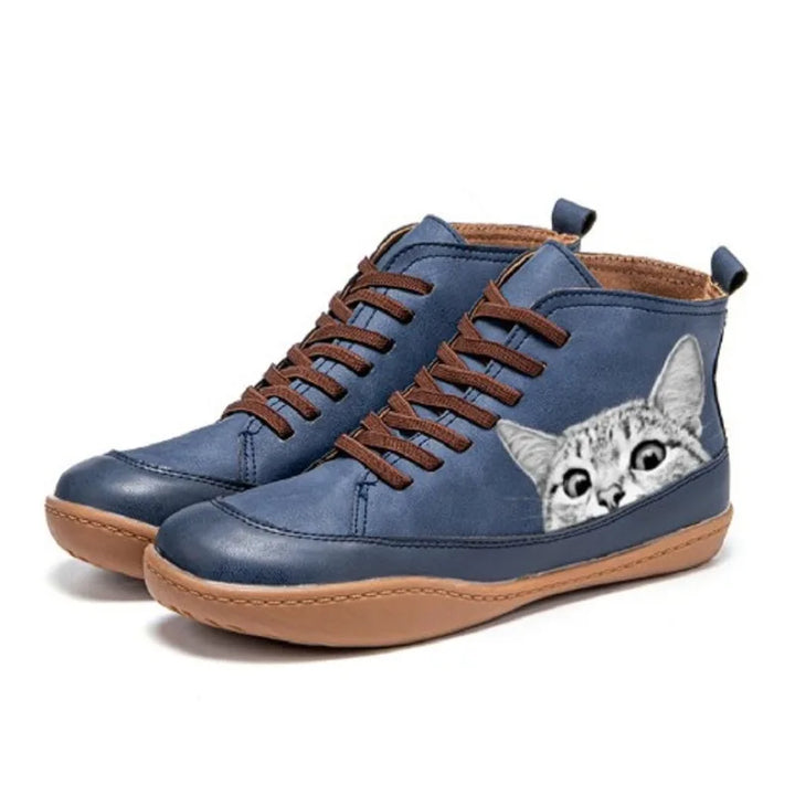 Navy blue high top boots with cat print detail, side view
