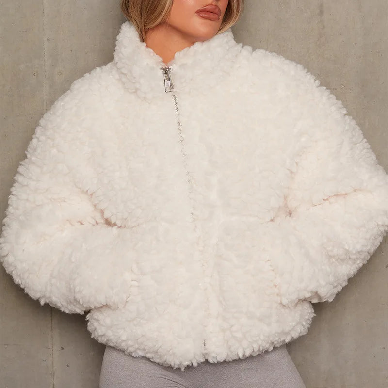 Woman wearing ivory curly textured cropped coat with zip front