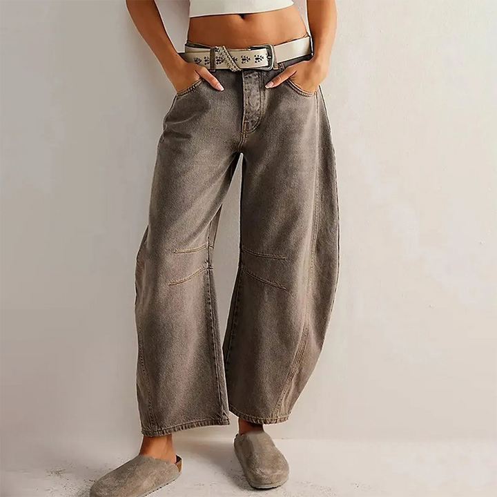 Close up of brown barrel leg jeans with belt