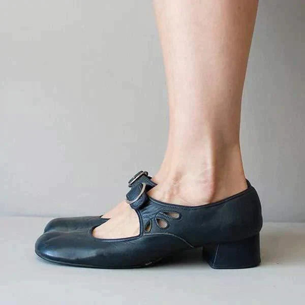 Navy blue leather Mary Jane flat side view showing cutout detail