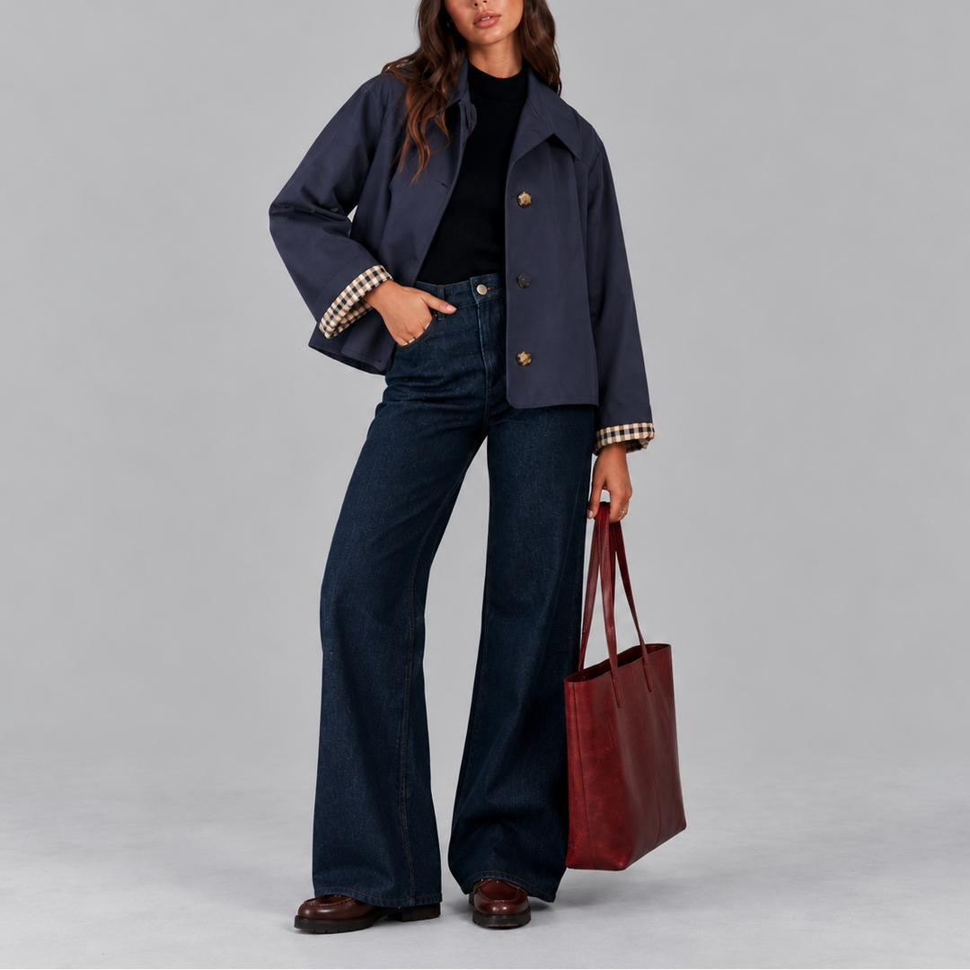 Navy cropped trench jacket front view with plaid lined cuffs