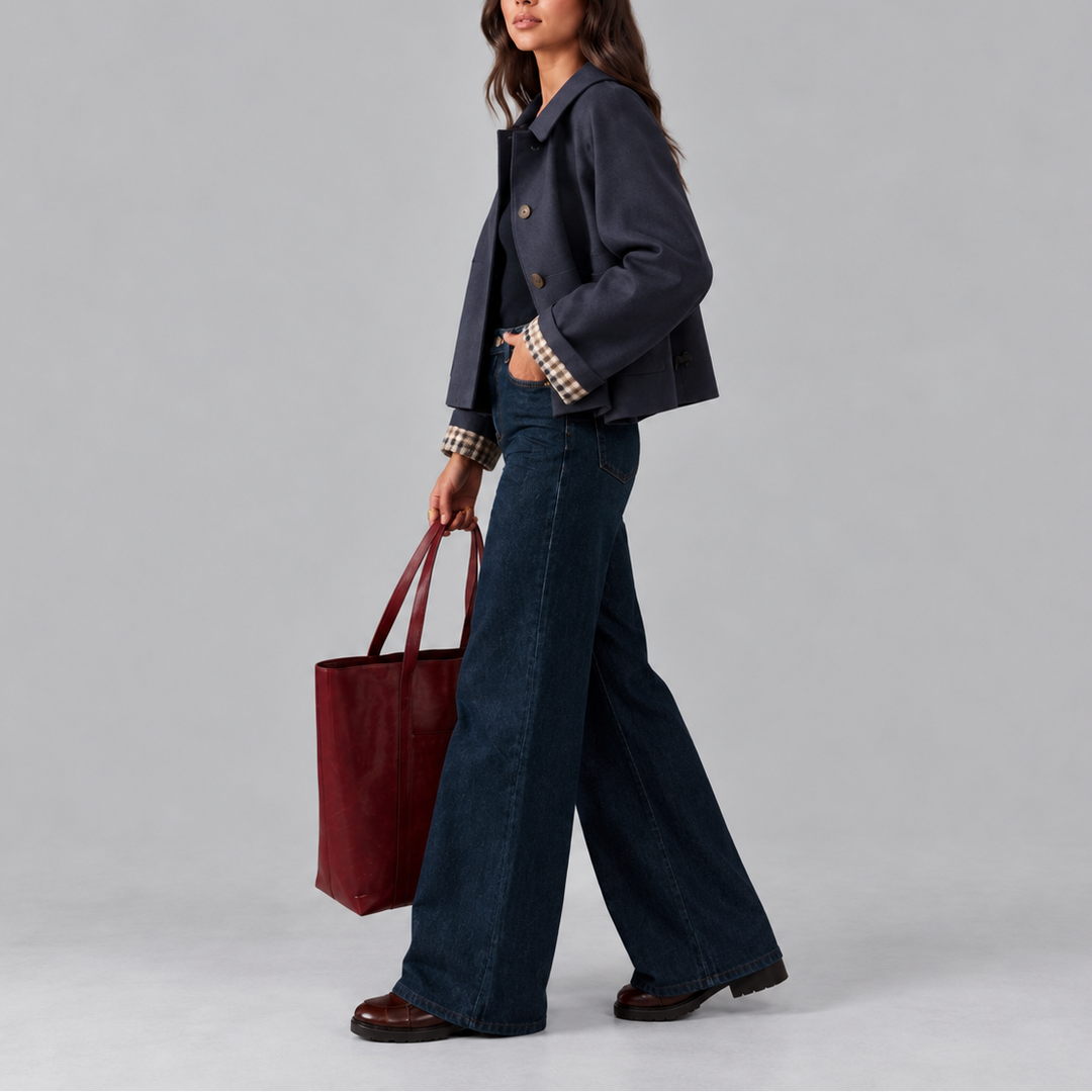 Navy cropped trench jacket side profile walking