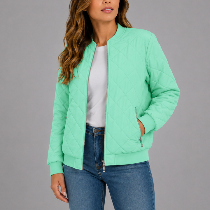 Woman wearing light green quilted bomber jacket