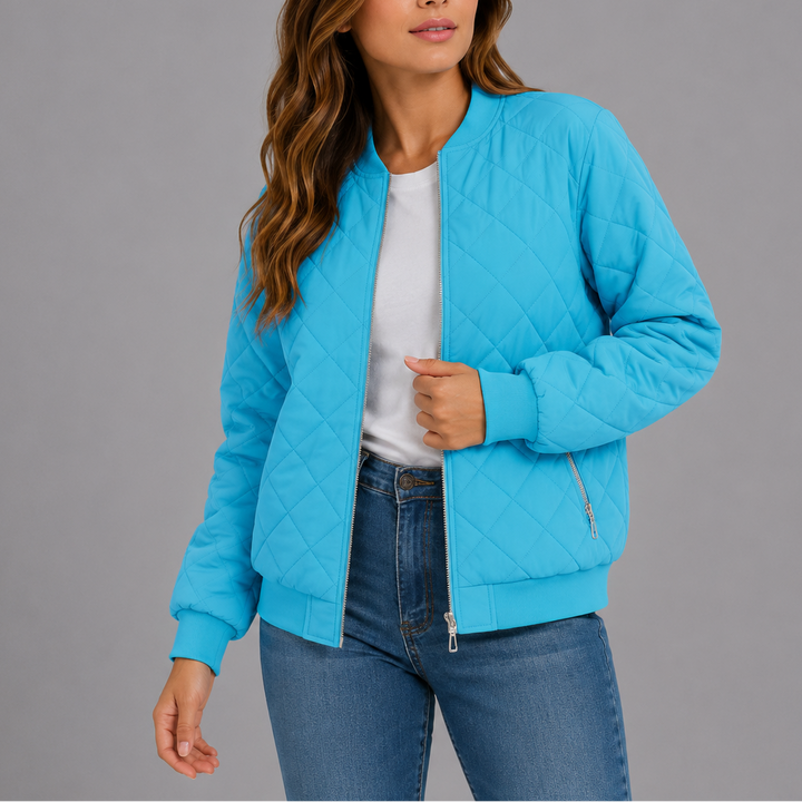 Woman wearing baby blue quilted bomber jacket