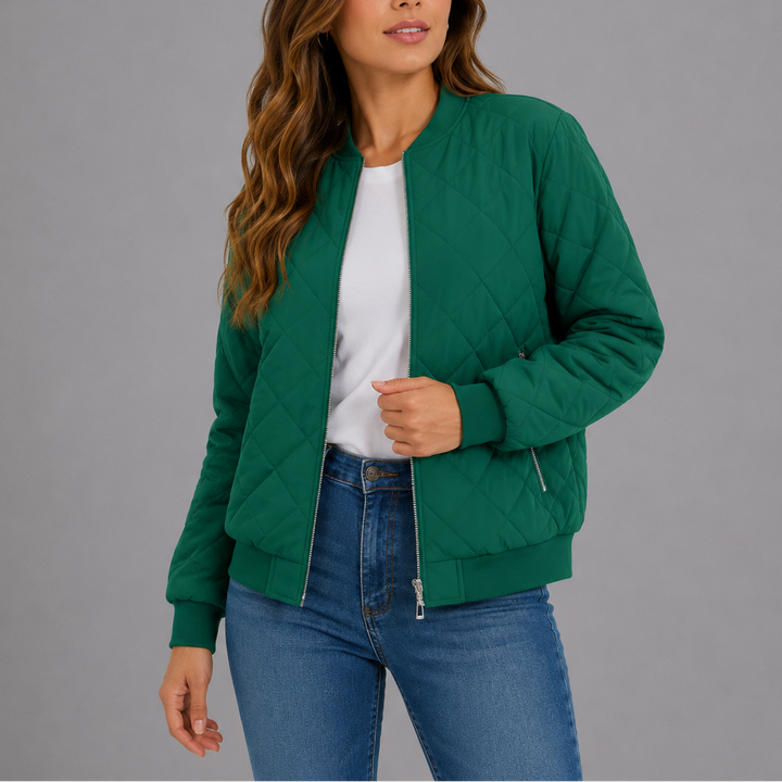Woman wearing green quilted bomber jacket with ribbed cuffs