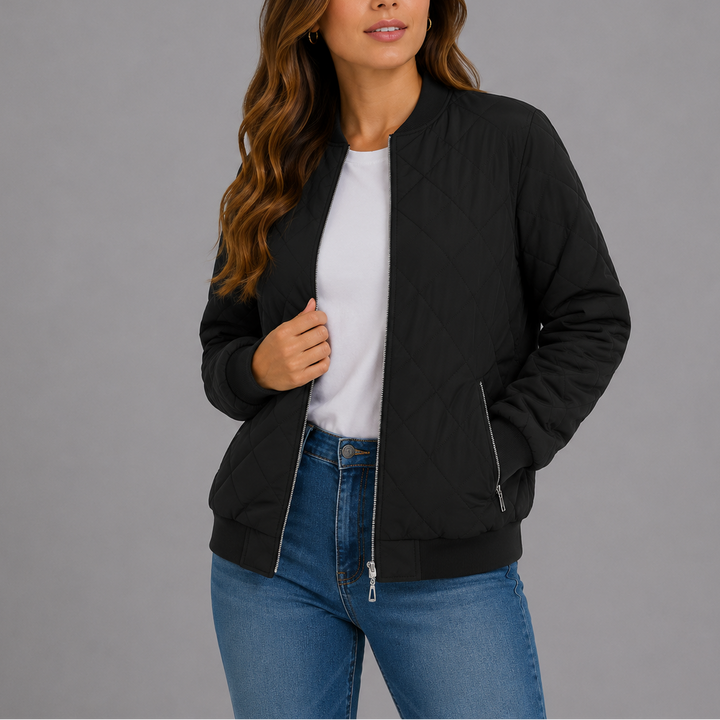Woman wearing black quilted bomber jacket with zip pockets