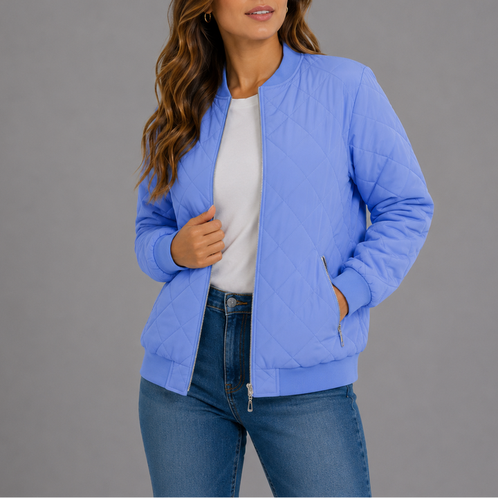 Woman wearing periwinkle blue quilted bomber jacket