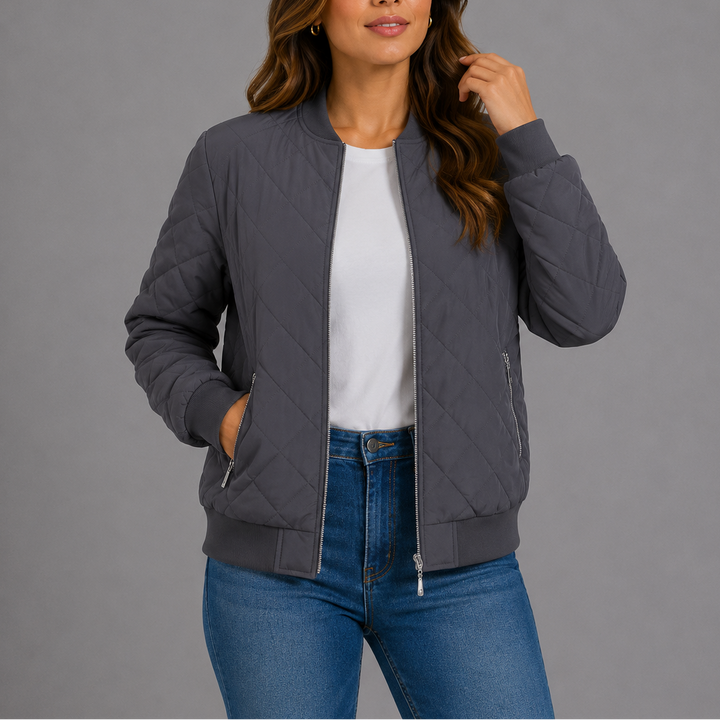 Woman wearing grey quilted bomber jacket with zip pockets