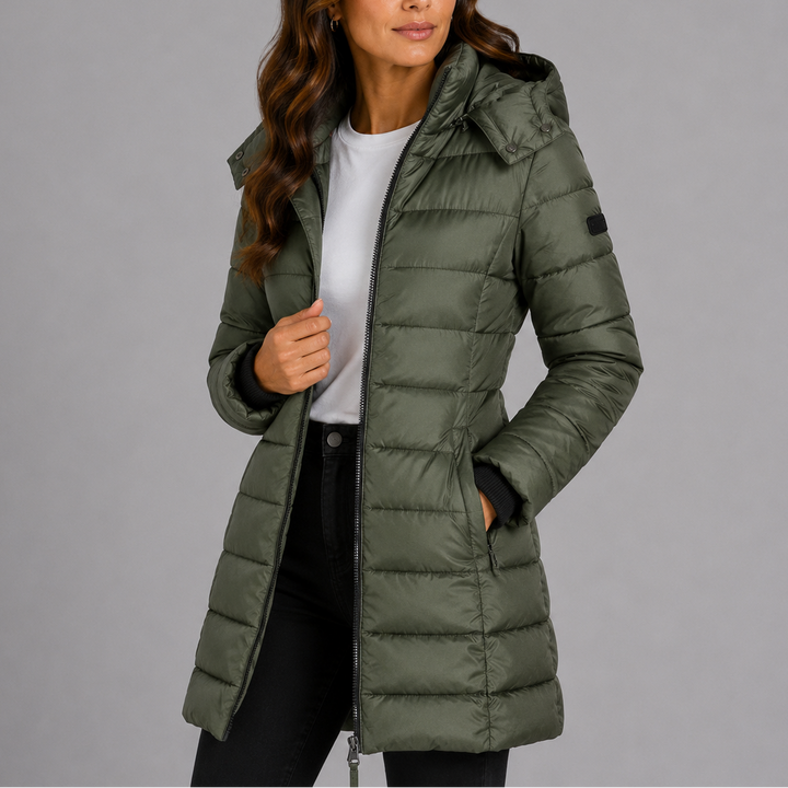 Woman wearing olive green hooded puffer jacket, front view