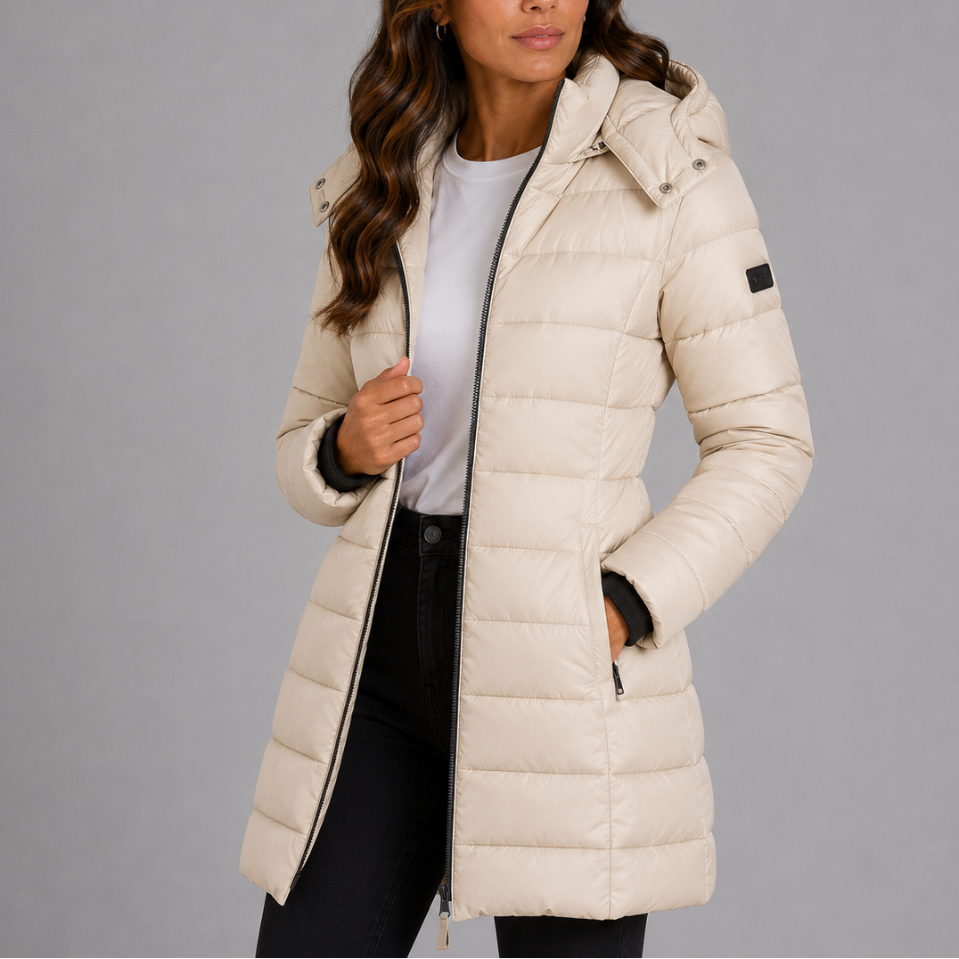 Woman wearing beige hooded puffer jacket, front view