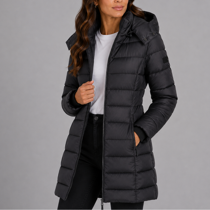 Woman wearing black hooded puffer jacket, front view