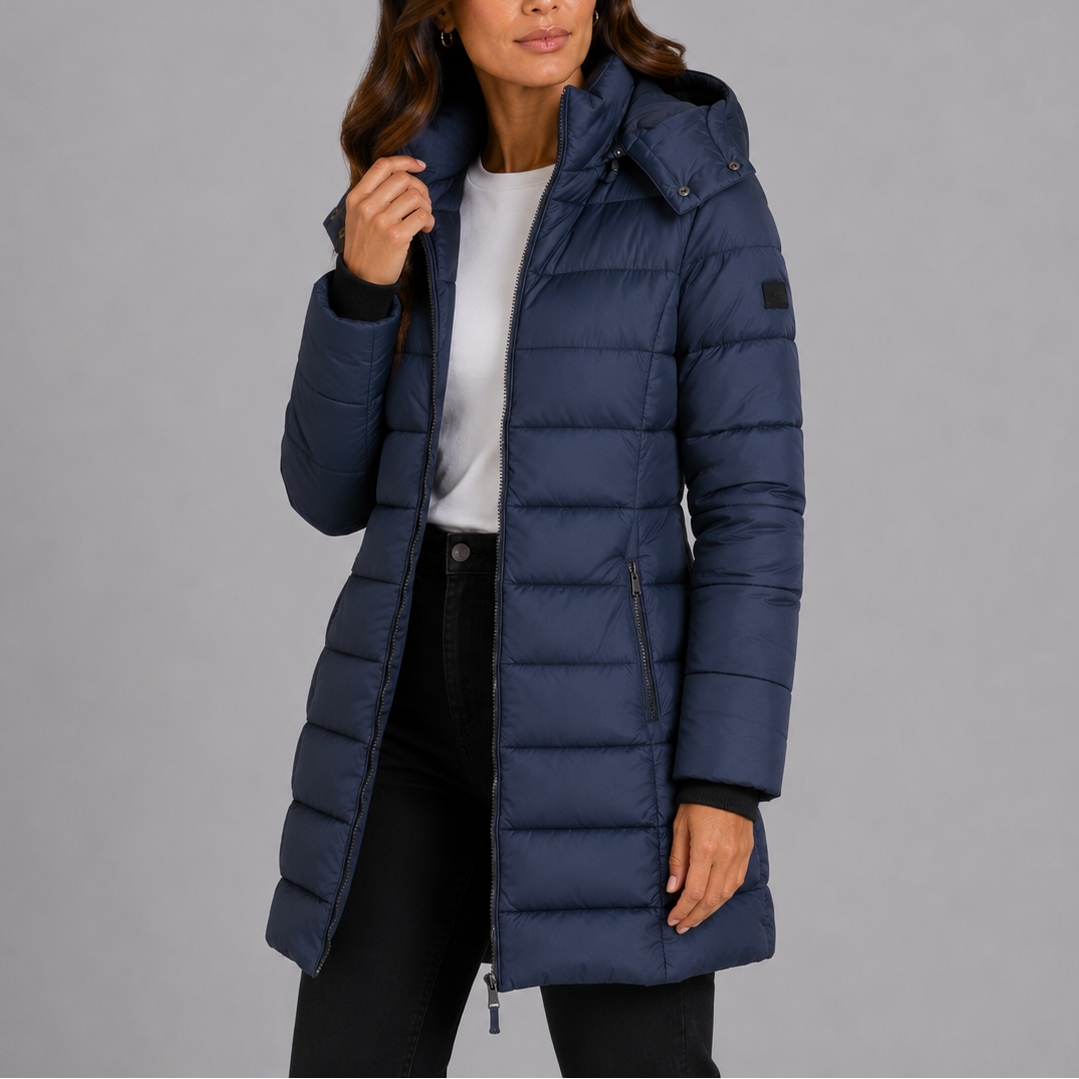 Woman wearing navy longline hooded puffer jacket, front view