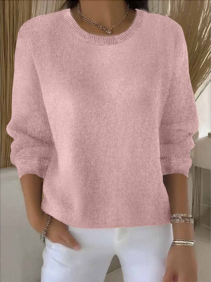 Pink pullover sweater with ribbed cuffs