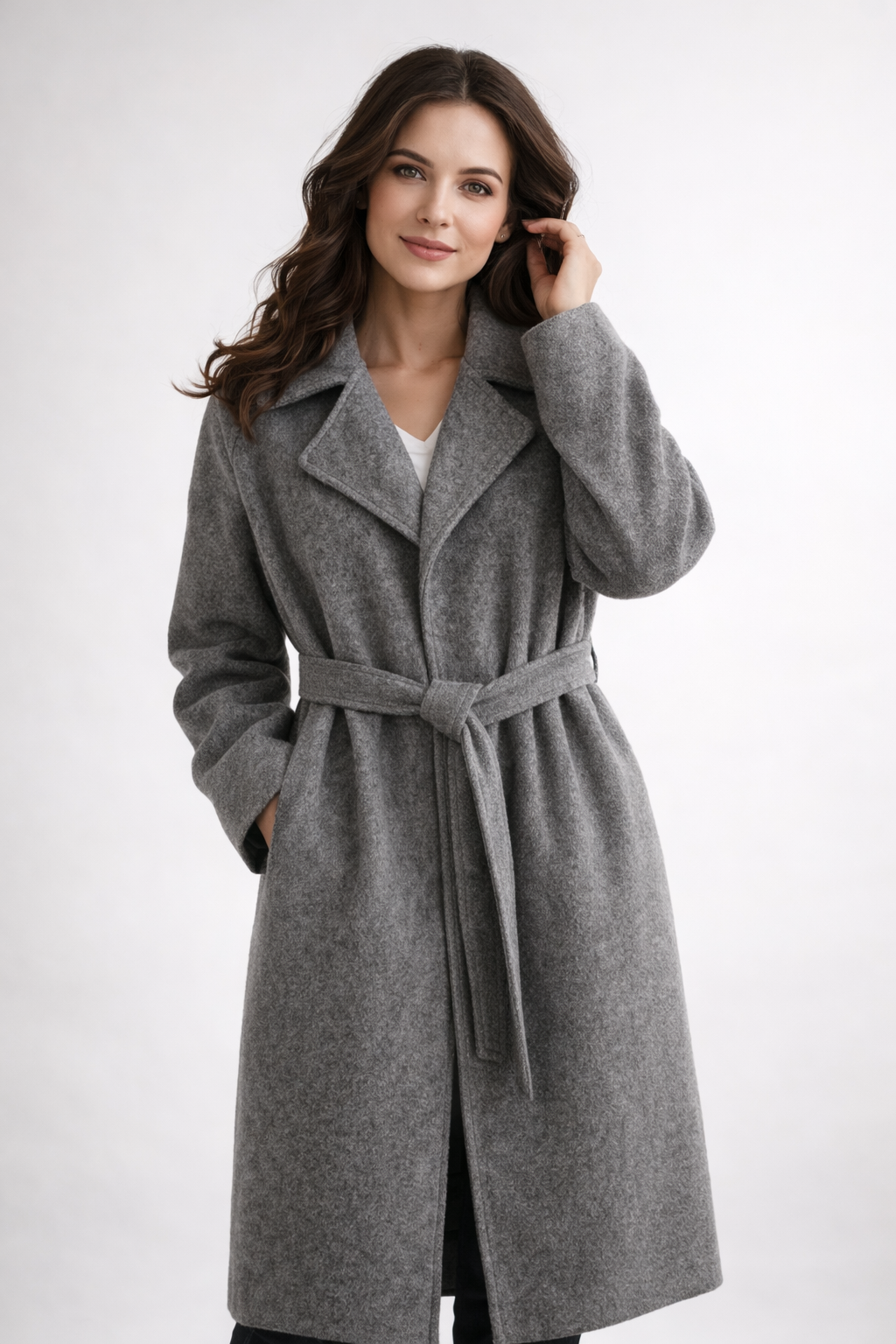 Model wearing gray belted wrap coat
