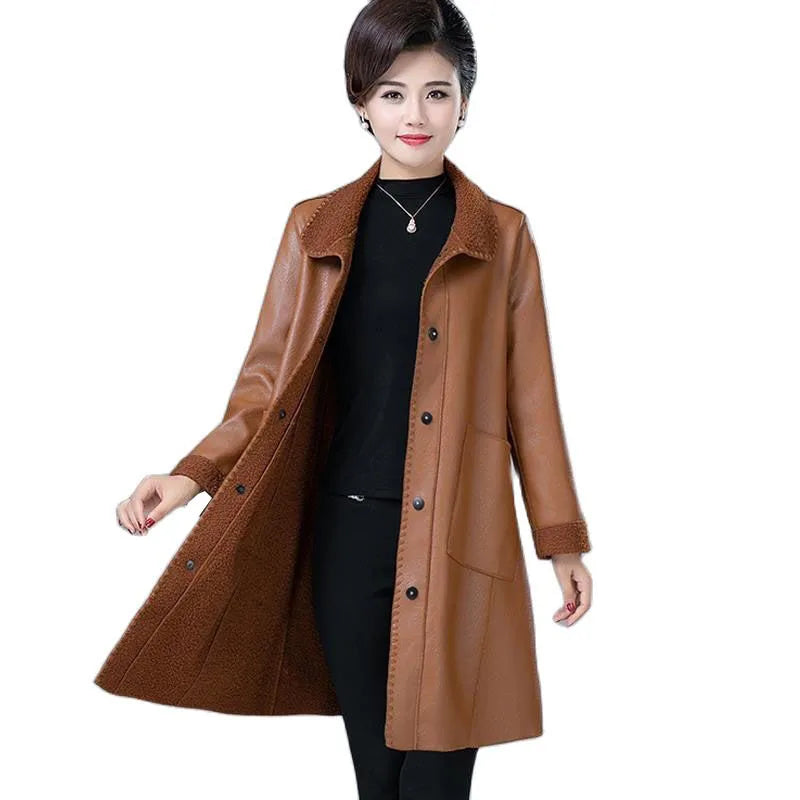 Smiling woman modeling khaki faux leather longline jacket with shearling collar