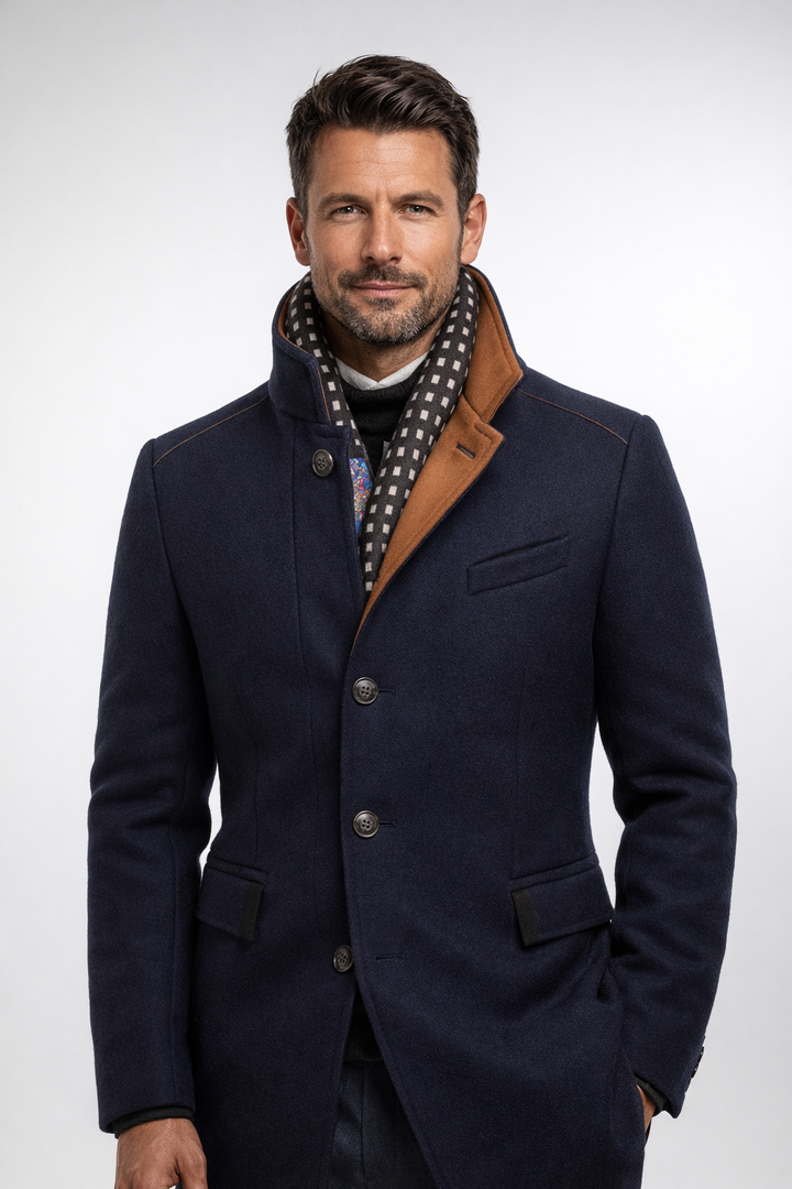 Man wearing navy wool blend overcoat with contrast stand collar
