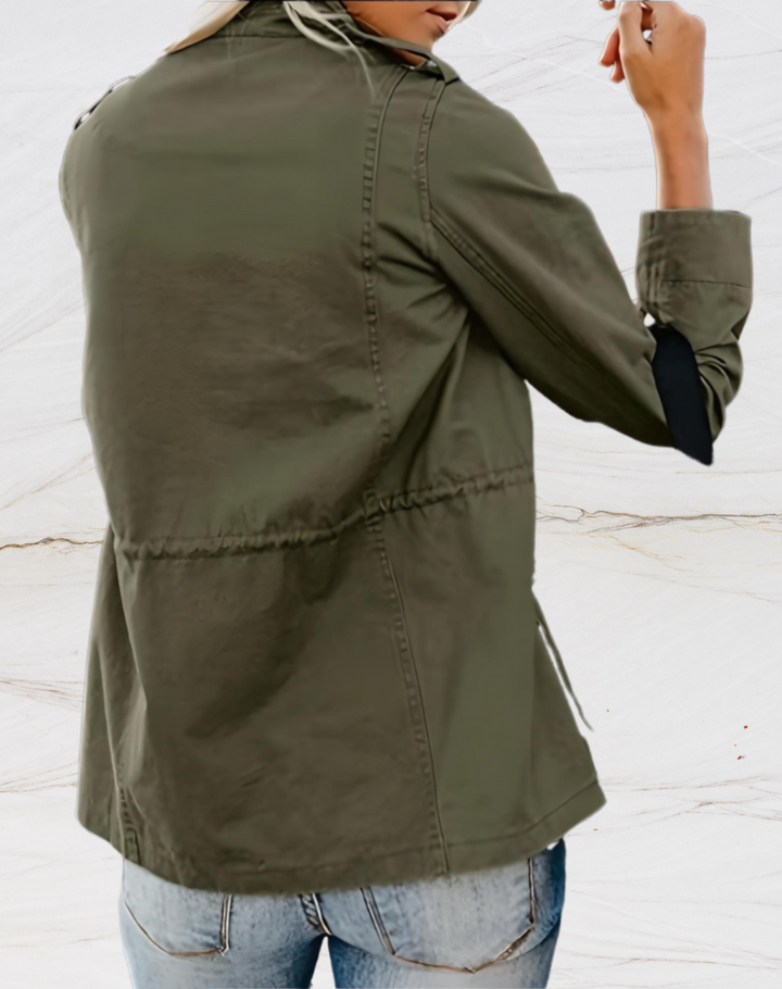 Back view of olive green utility jacket showing seam detailing