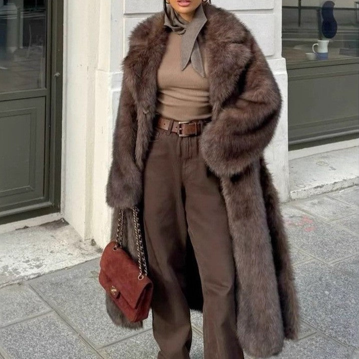 Woman wearing dark brown oversized faux fur longline coat with notched collar