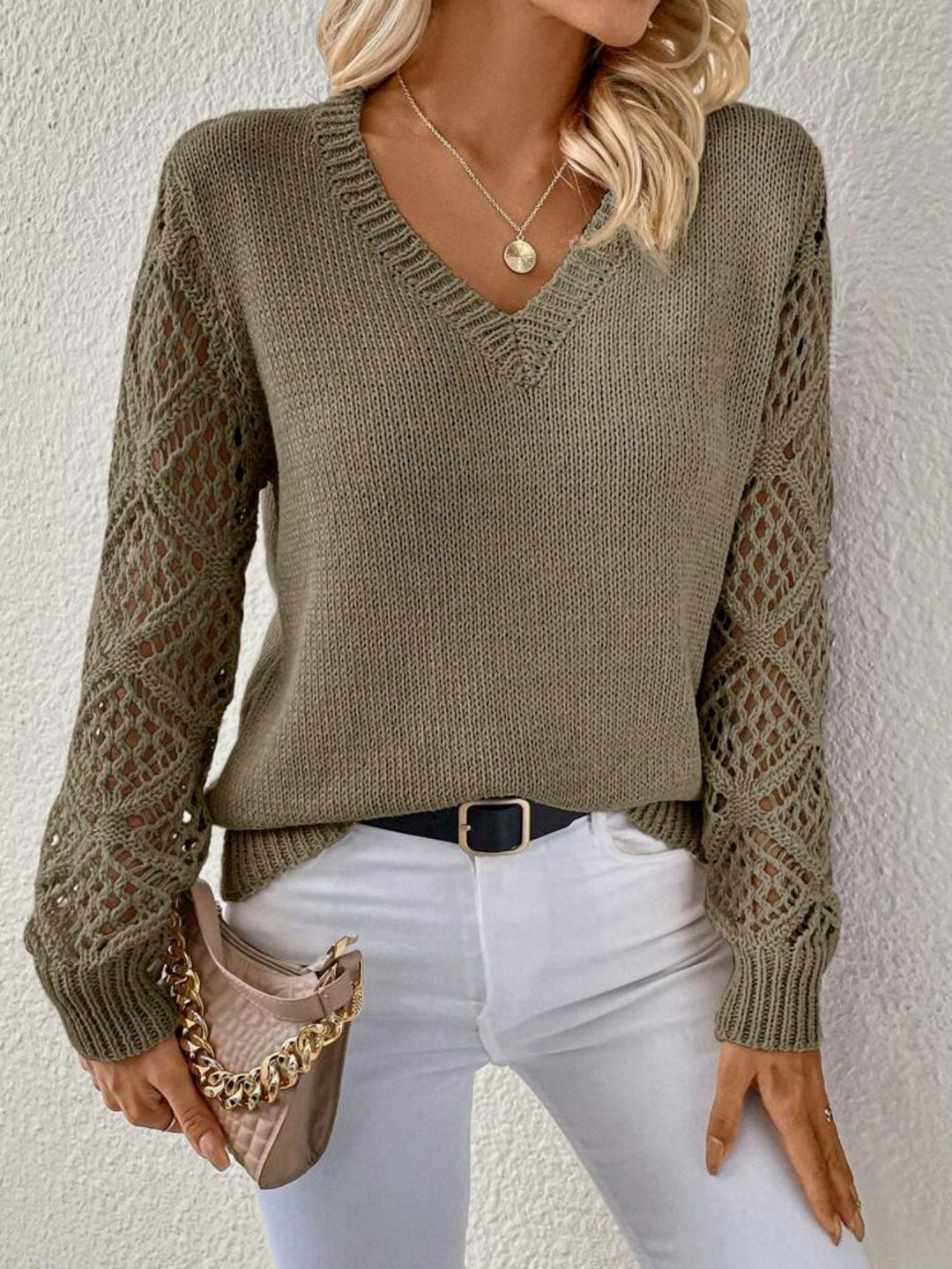 Green open knit sweater with crochet sleeves, front view