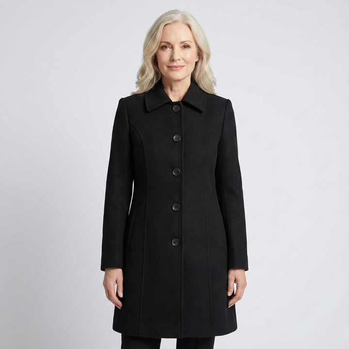 Woman wearing black fit and flare coat with point collar and buttons